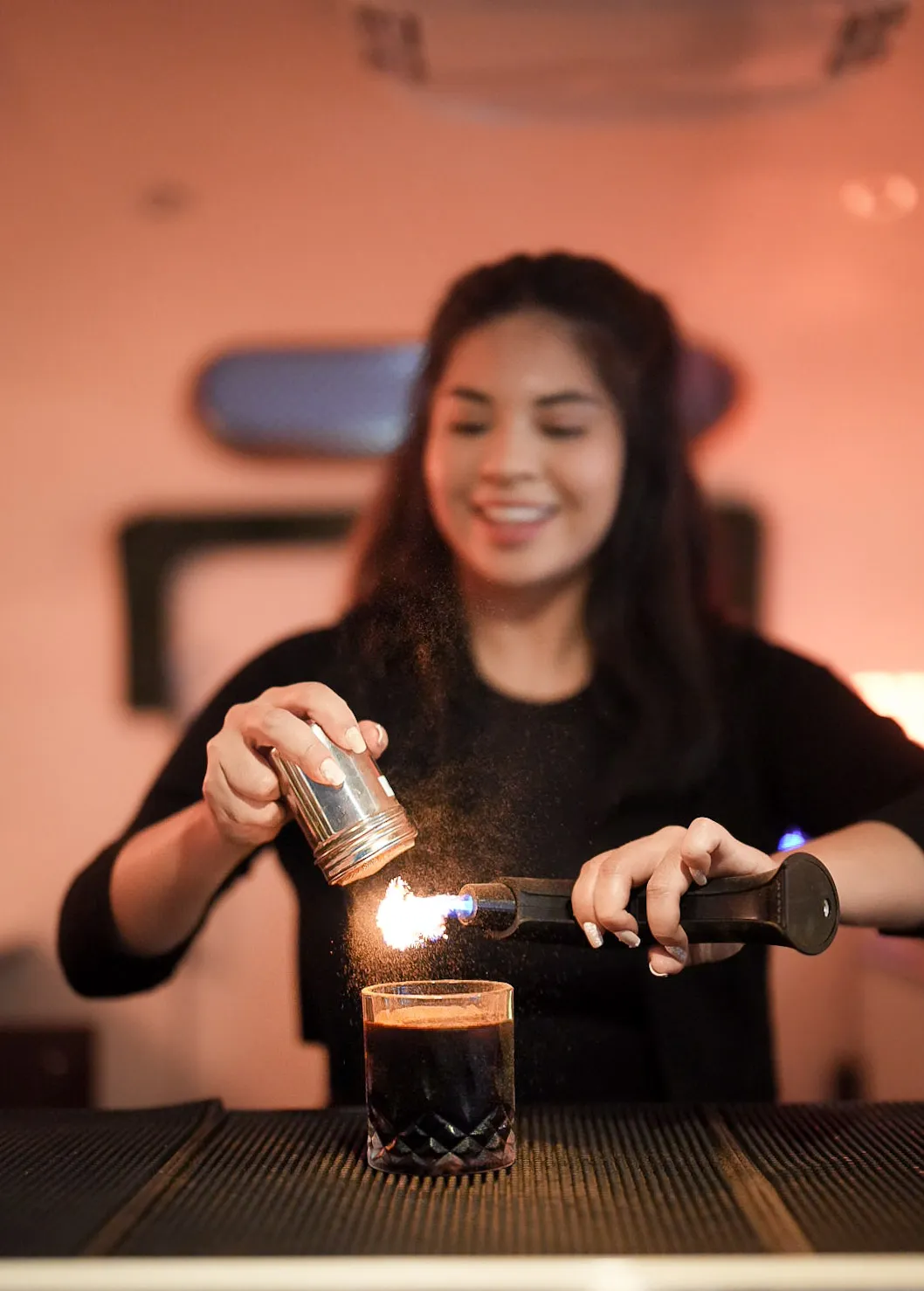 a bartender preparing a drink