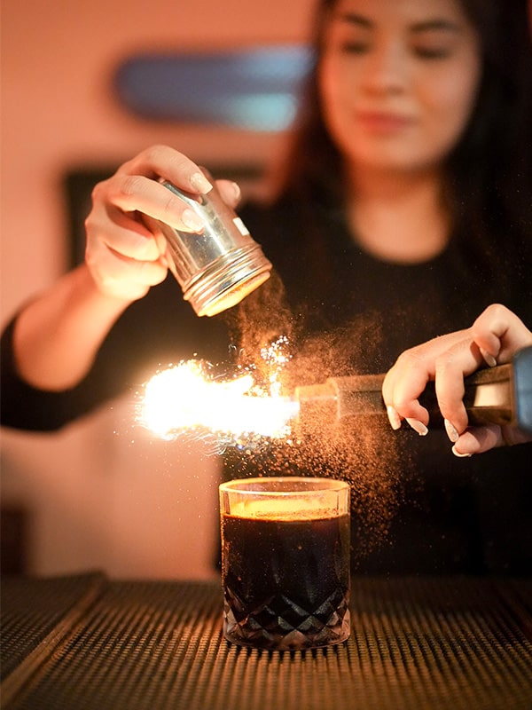 Bartender making a cocktail in mobile bar